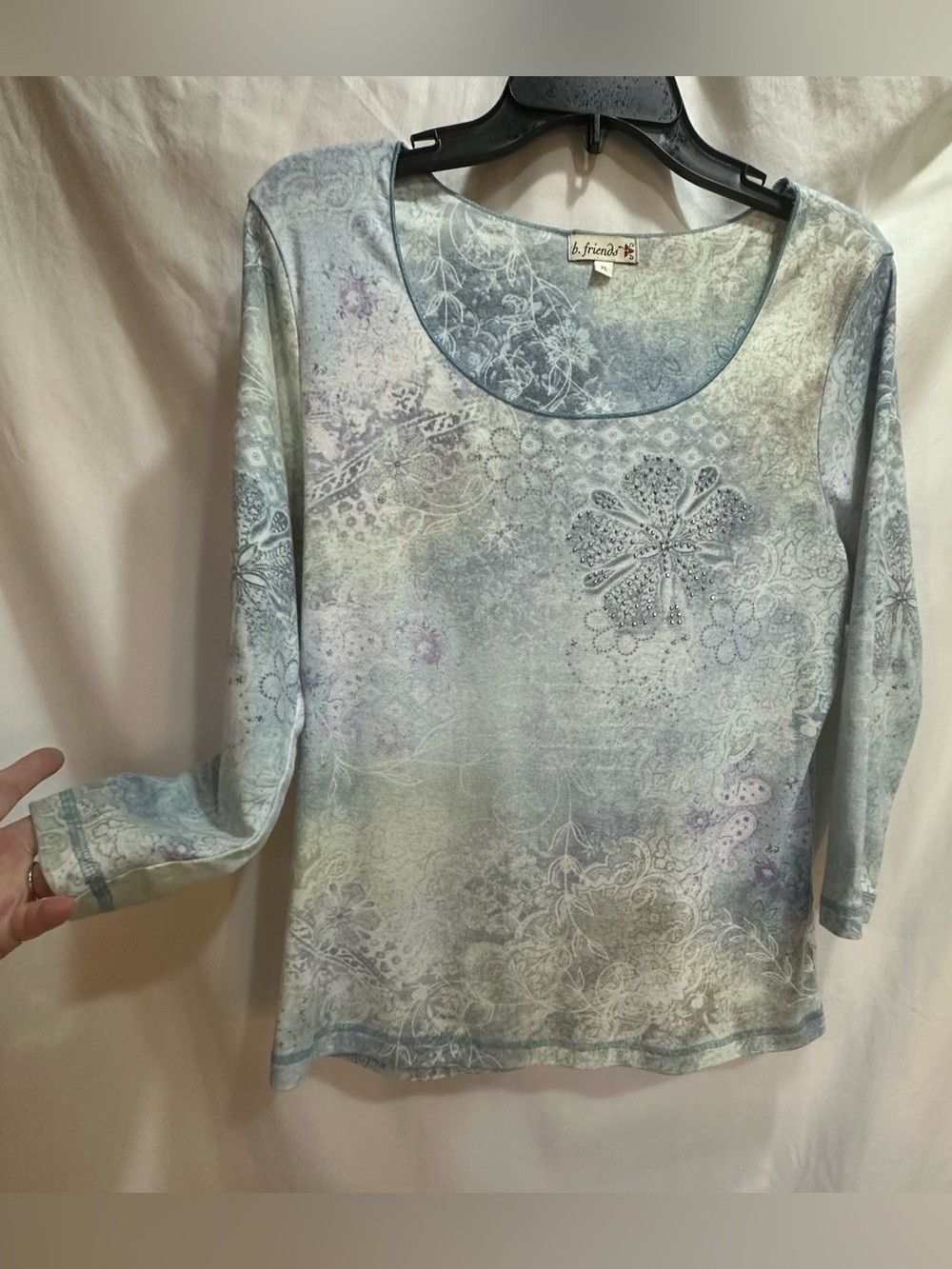 Light Blue Floral Scoop Neck Women's Top with a front flower with gem accents. - Picture 2 of 9